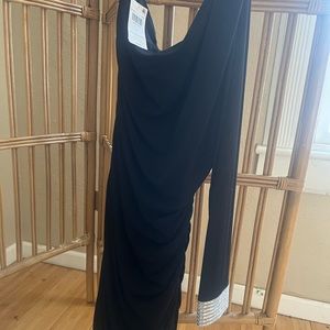 Chanel ,medium ,little black dress never been worn brand new with tags